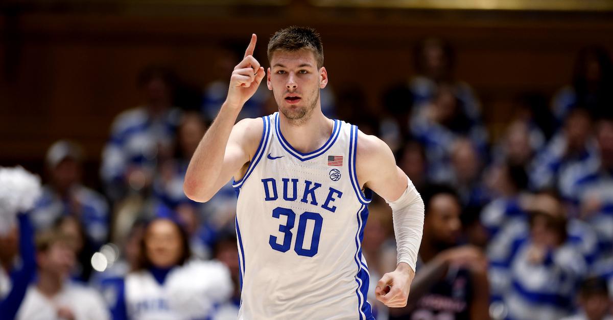 Kyle Filipowski #30 of the Duke Blue Devils reacts following a dunk against the Virginia Cavaliers at Cameron Indoor Stadium on March 2, 2024 in Durham, North Carolina