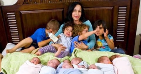 Octomom with her octuplets in bed.