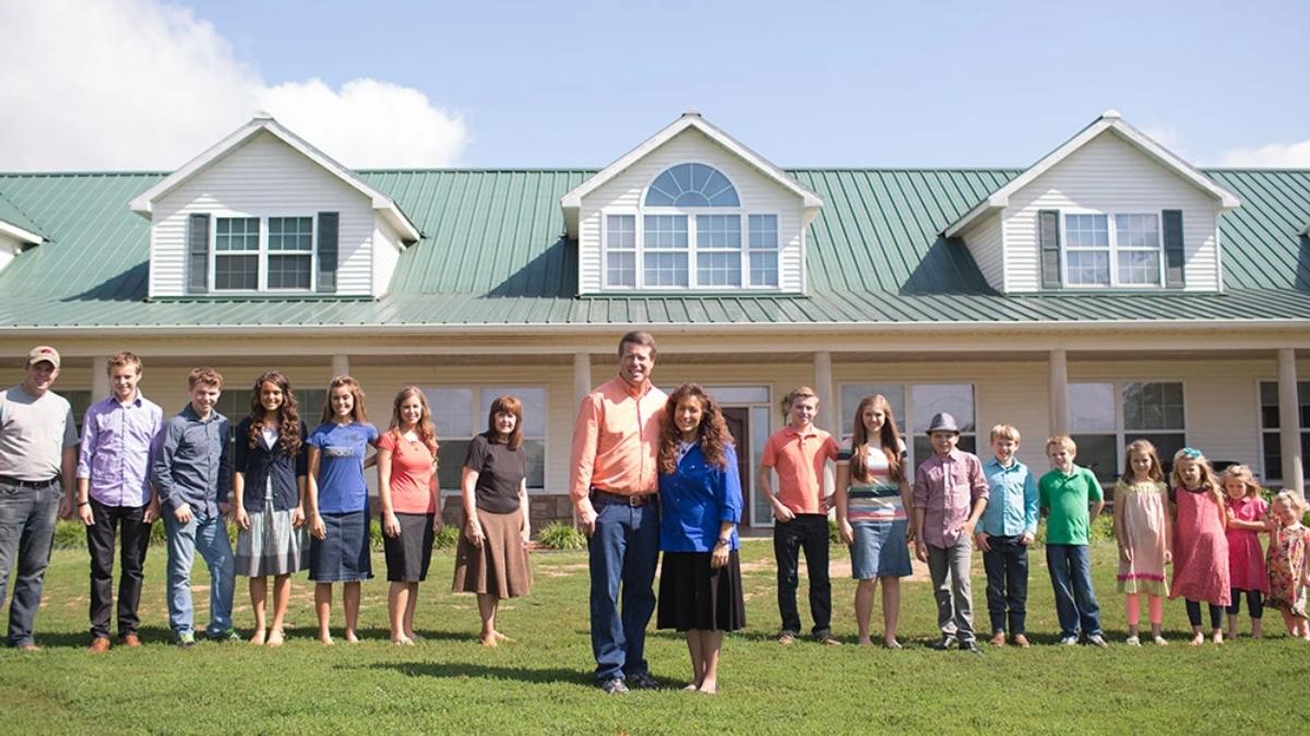 The Duggar family in front of their home in Arkansas