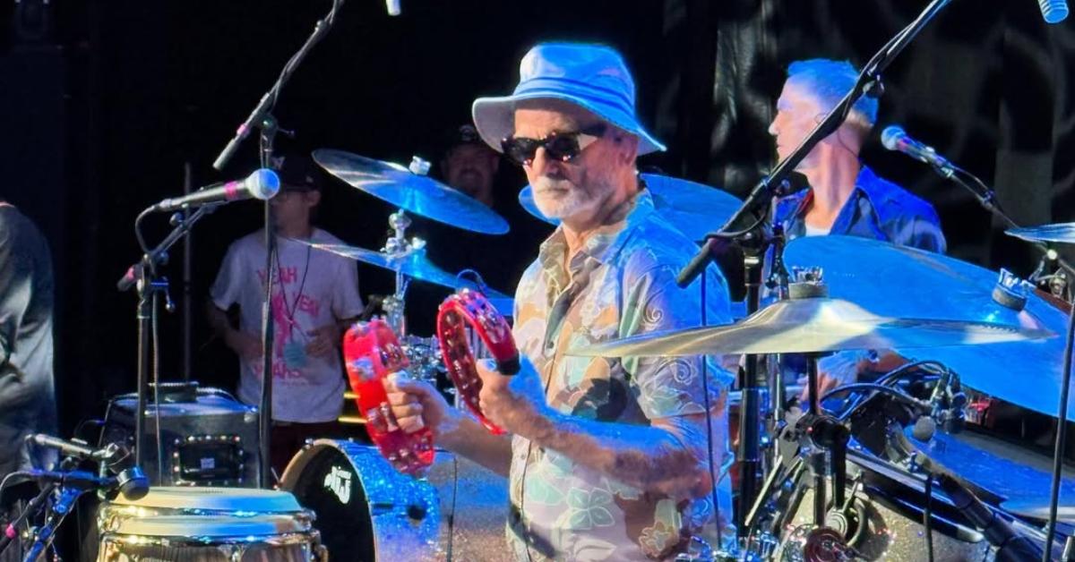 Bill Murray plays the tambourine on-stage with his band.