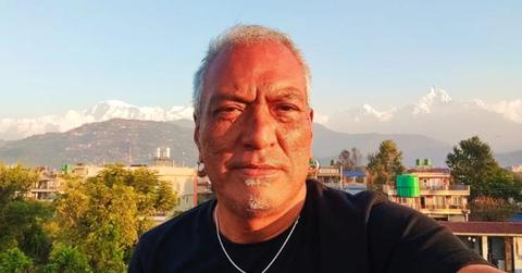 Robin Tamang in front of mountains