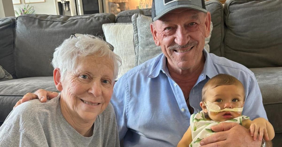 Troy Landry, his wife, and their grandchild Crue.