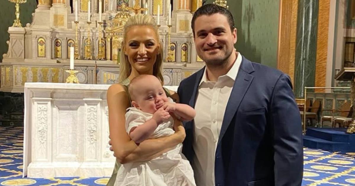 Carley Shimkus and her husband Peter at their son's baptism.