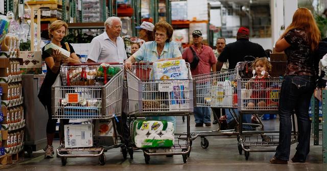 People fill up their shopping carts at Costco