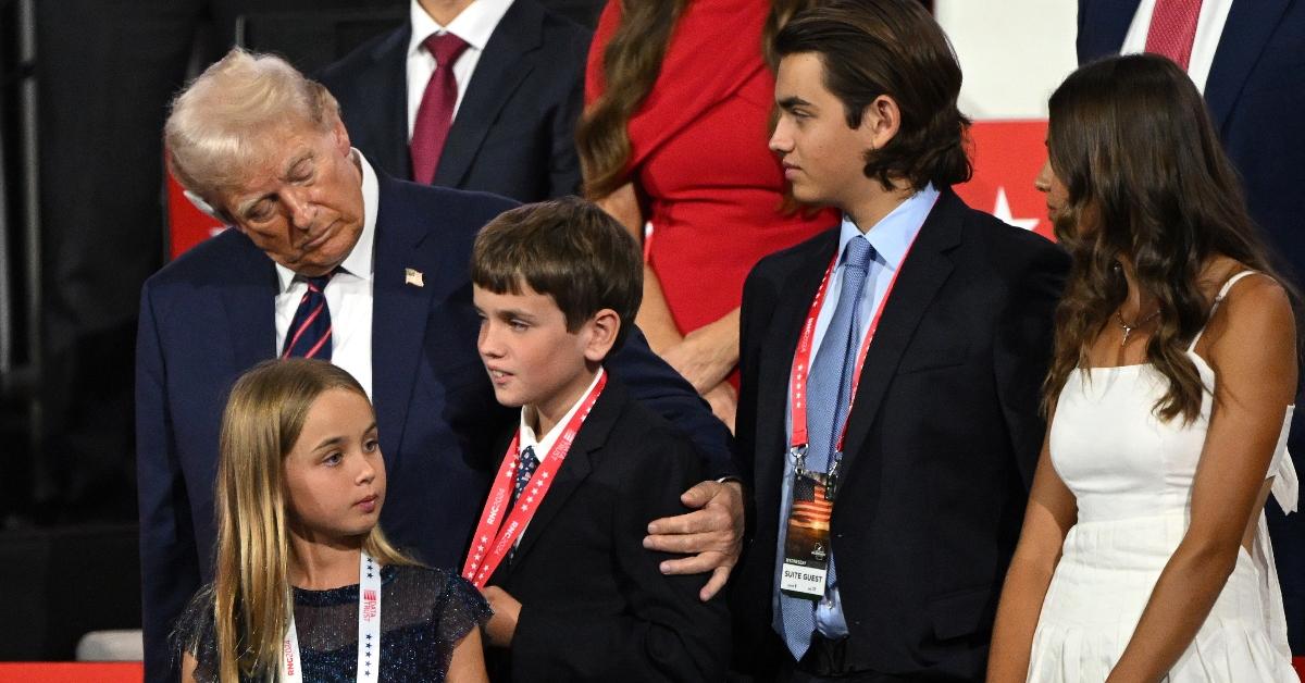 Republican presidential candidate, former U.S. President Donald Trump stands with his grandchildren on the third day of the Republican National Convention at the Fiserv Forum on July 17, 2024 in Milwaukee, Wisconsin. Delegates, politicians, and the Republican faithful are in Milwaukee for the annual convention, concluding with former President Donald Trump accepting his party's presidential nomination. The RNC takes place from July 15-18. (Photo by Leon Neal/Getty Images)