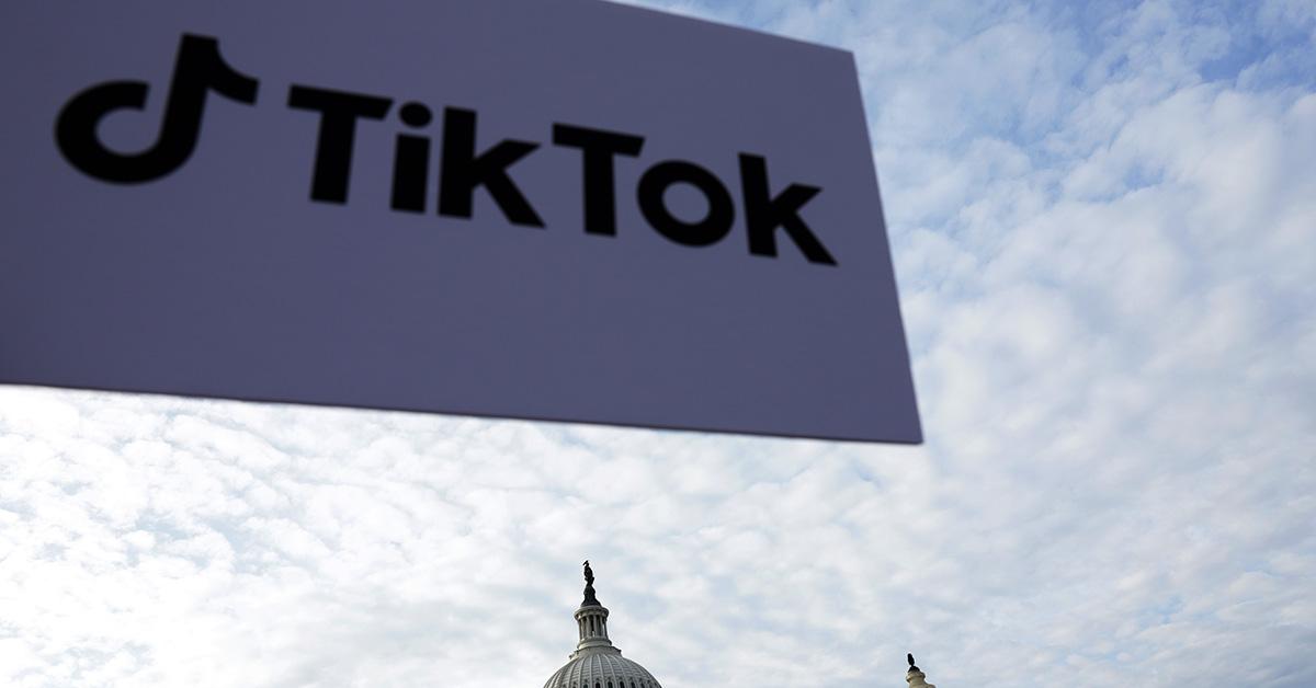 A TikTok logo against the sky with the US Capitol in the background. 