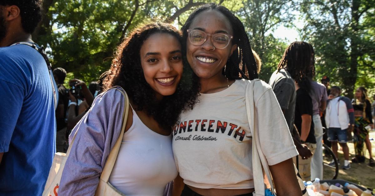 Two women in a crowd during a Juneteenth celebration in Fort Greene Park on June 19, 2022.