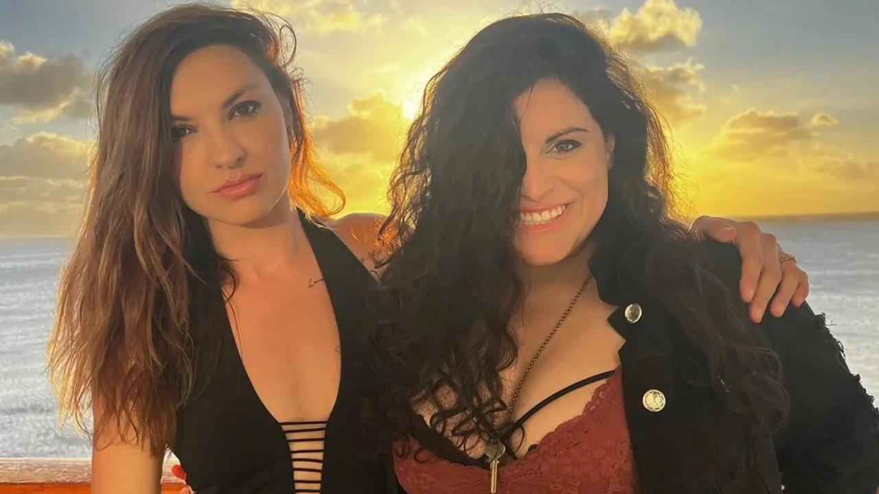 Chrissy and Bria standing near the ocean