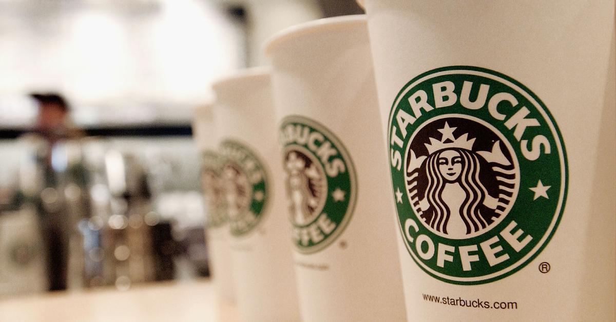 The Messed-Up Reason Starbucks Baristas Are Putting Stickers On Your Cups