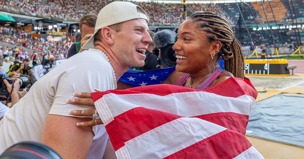 Tara Davis-Woodhall of the United States celebrates her silver medal win with husband Hunter Woodhall