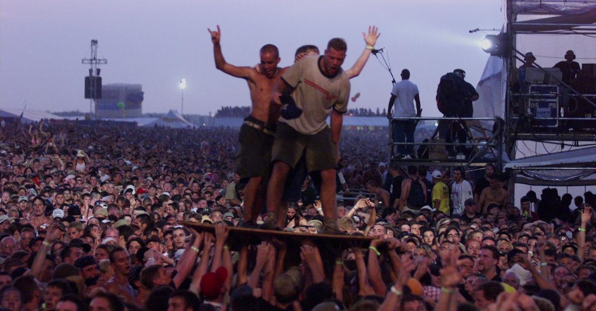 Woodstock '99 crowdsurfing on wooden panels