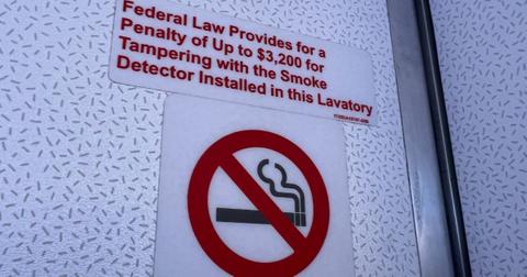 A placard explaining the law around tampering with a smoke detector