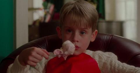 Kevin McCallister (Macaulay Culkin) eating junk and watching rubbish in 'Home Alone.'