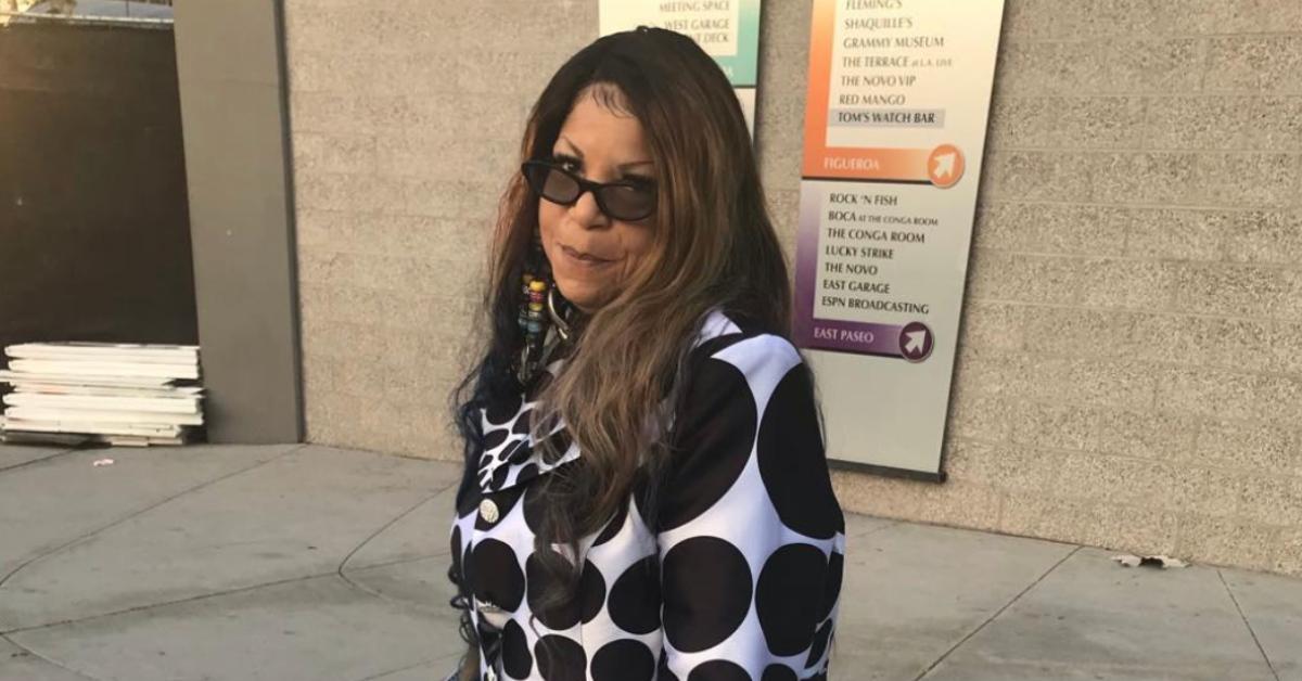 Prince's sister, Tyka Nelson, wearing a black and white coat.