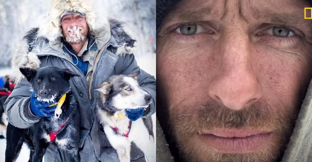 Jessie, with ice coating his mustache and beard, poses with two dogs.