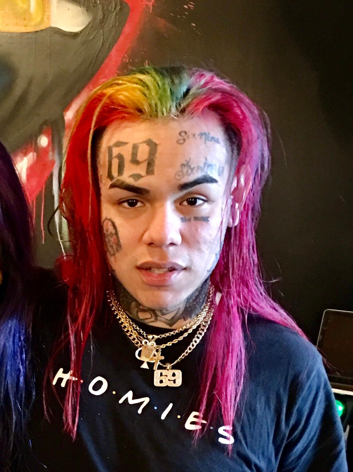 Tekashi 6ix9ine with rainbow hair.