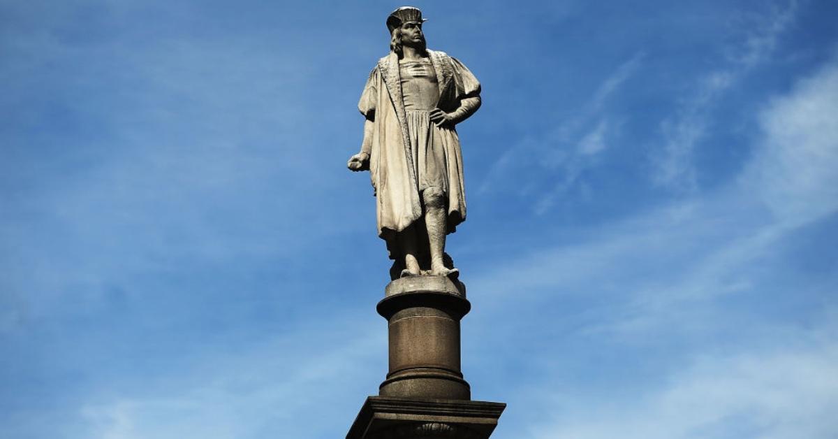 Statue of Christopher Columbus with a blue sky background.