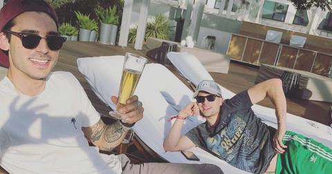 Max Boyens and Tom Schwartz lay by a pool