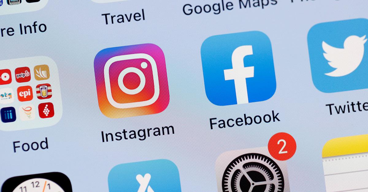 Instagram next to other social apps on a phone. 