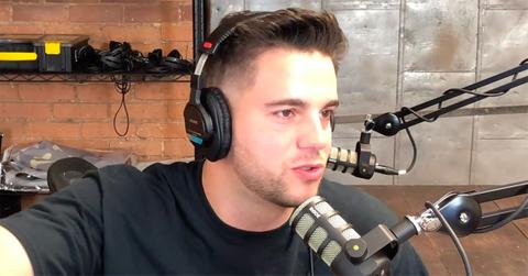 Chris Konya speaking into a microphone.