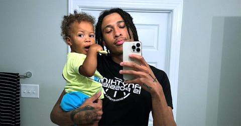 R.J. Hampton with his son Halo in his arms.