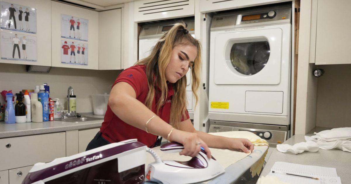 Sabrina Muller irons in laundry area on 'Below Deck Med'