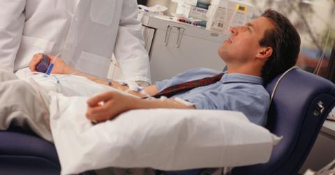 A man looking at his doctor during a test