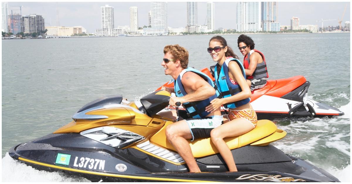 Friends riding jet skis together