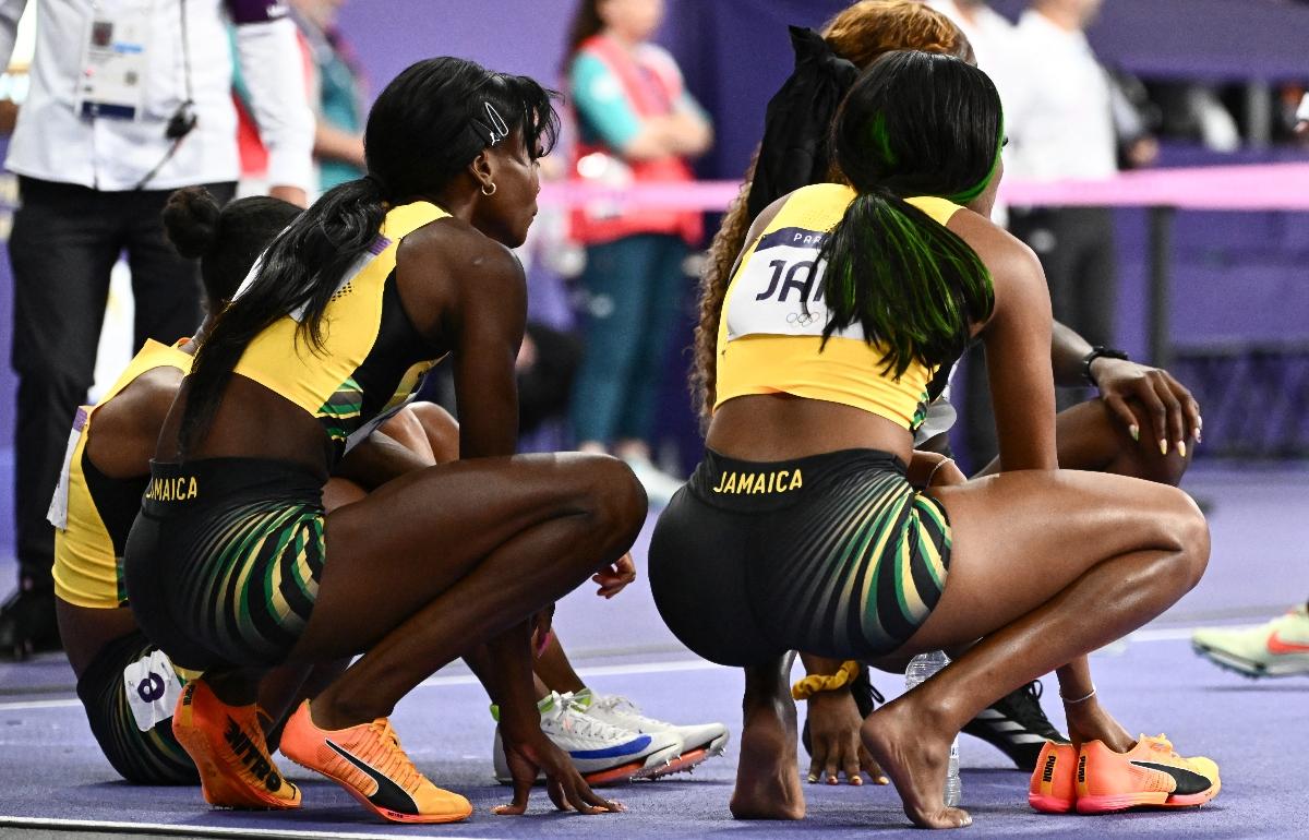 Jamaica's team reacts after they did not finish the women's 4x400m relay final of the athletics event at the Paris 2024 Olympic Games at Stade de France in Saint-Denis, north of Paris, on August 10, 2024. (Photo by Jewel SAMAD / AFP) (Photo by JEWEL SAMAD/AFP via Getty Images)