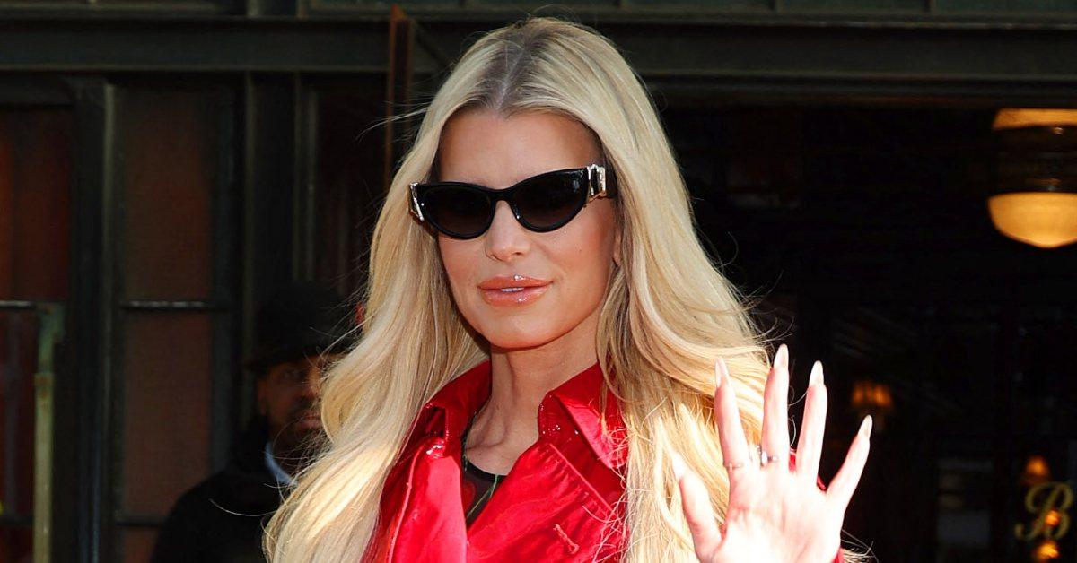 Jessica Simpson wearing sunglasses and waving