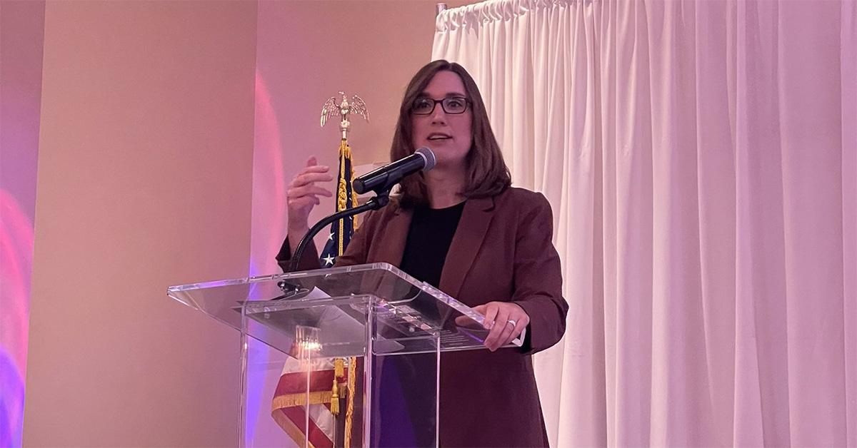 Sarah McBride speaking at a lectern 