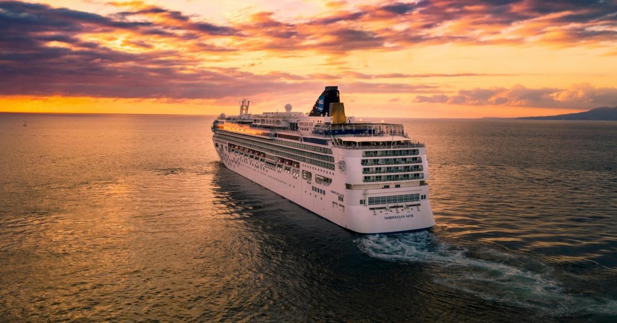 A cruise ship sailing at sunset.