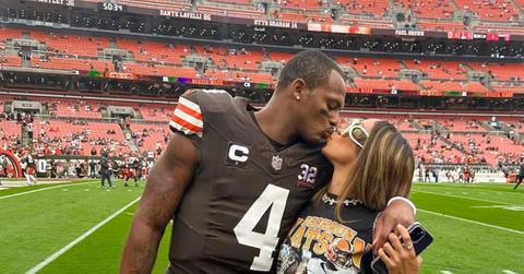Deshaun Watson kissing Jilly Anais on the Browns field.