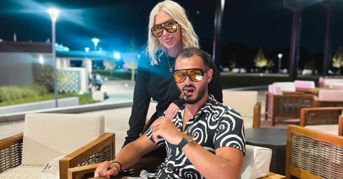 Tigerlily and Adnan together by a pool.