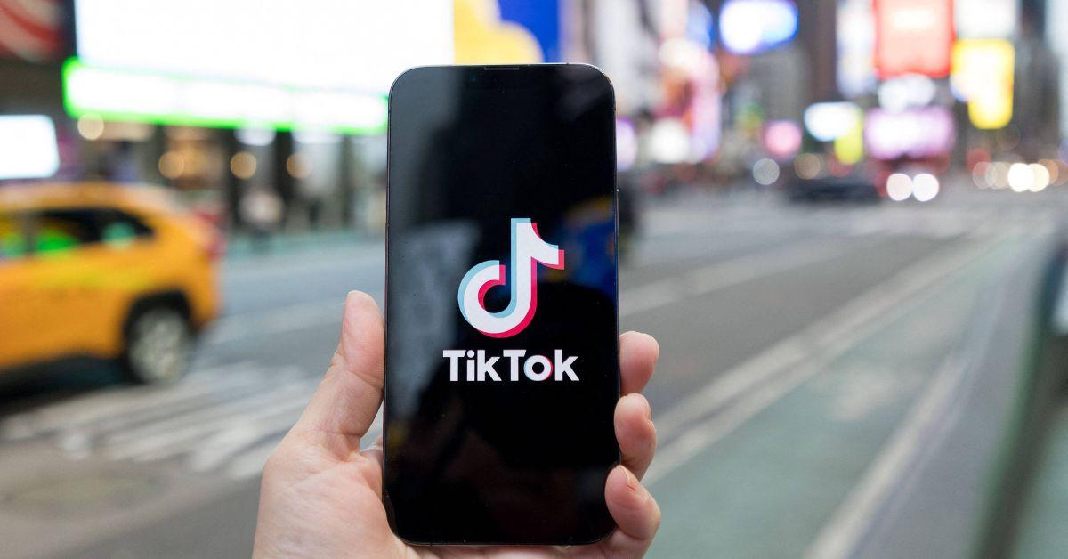 The TikTok logo on a phone in Times Square. 