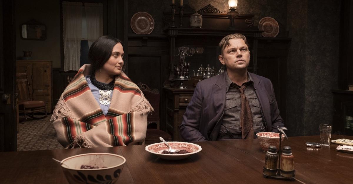 Actors in 'Killers of the Flower Moon' sitting at a dinner table