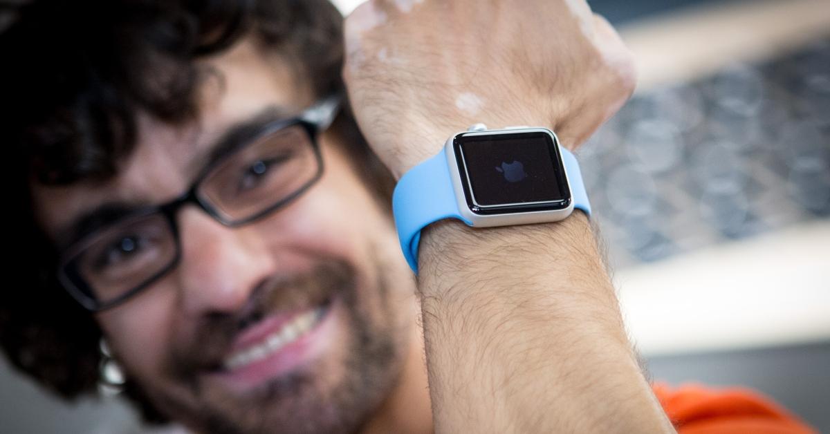 Man wearing a blue apple watch.