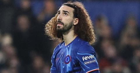 Marc Cucurella walking on the field during a game in 2025.