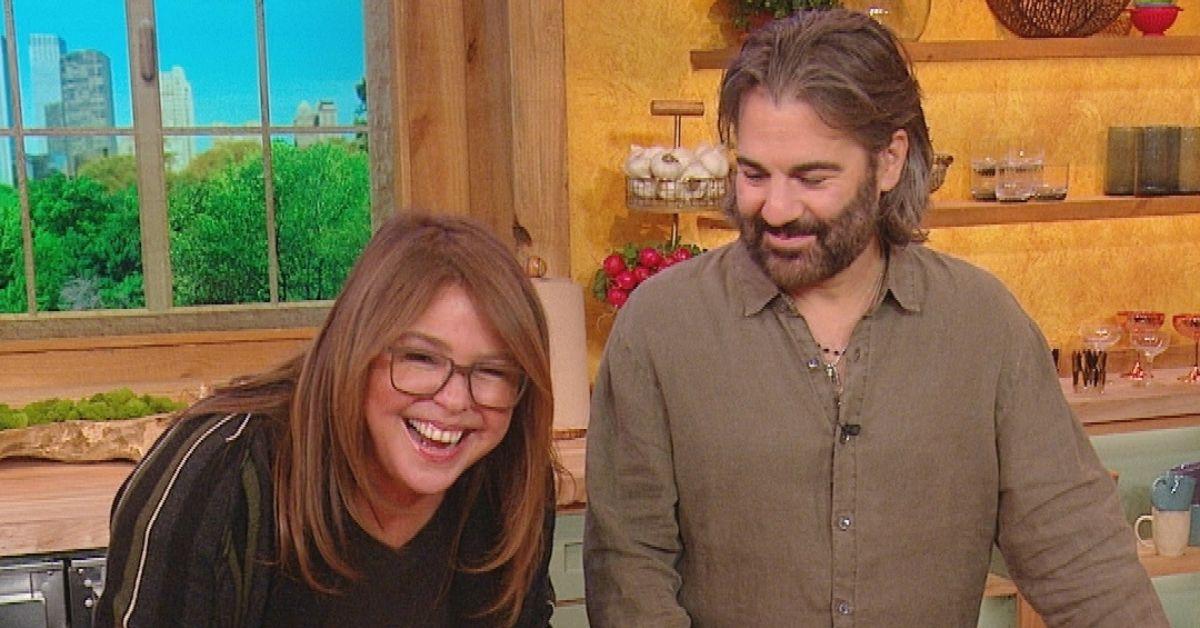 (l-r): Rachael Ray and her husband, John M. Cusinamo, laughing on set of 'Rachael Ray Show.'