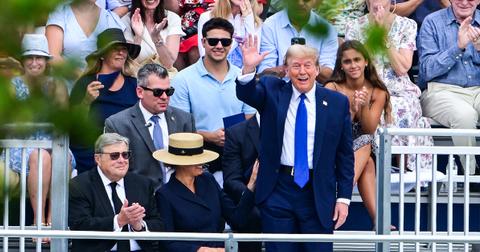Donald Trump waves at Barron Trump's graduation.