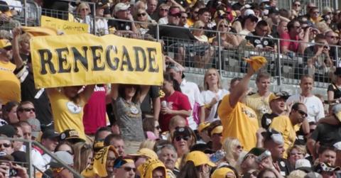 Steelers fans holding a Renegade sign.