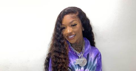 Enchanting wearing a purple and blue hoodie