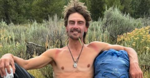 Michael Garner sittiing on the ground.