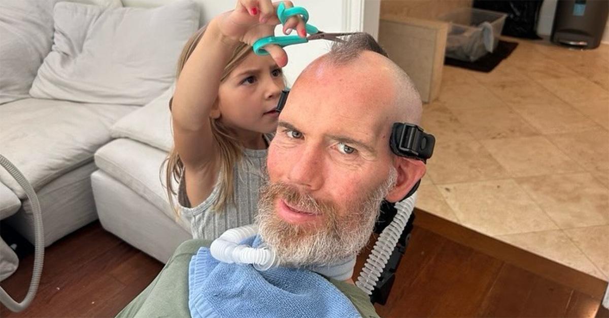 Steve Gleason getting a haircut from his daughter. 