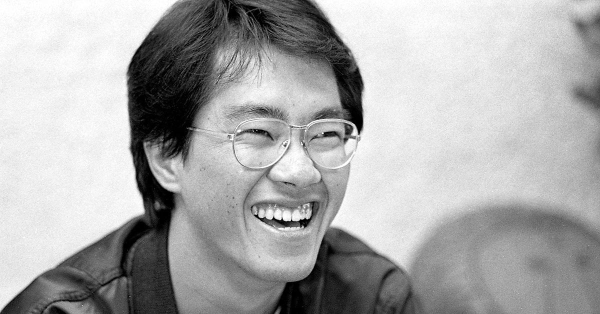 Akira Toriyama smiling with glasses on. 