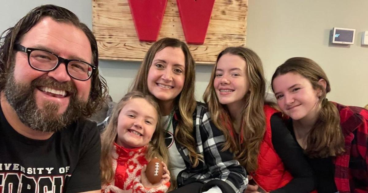 Rutledge Wood, Rachel Wood, and their three daughters smile for a christmas selfie.
