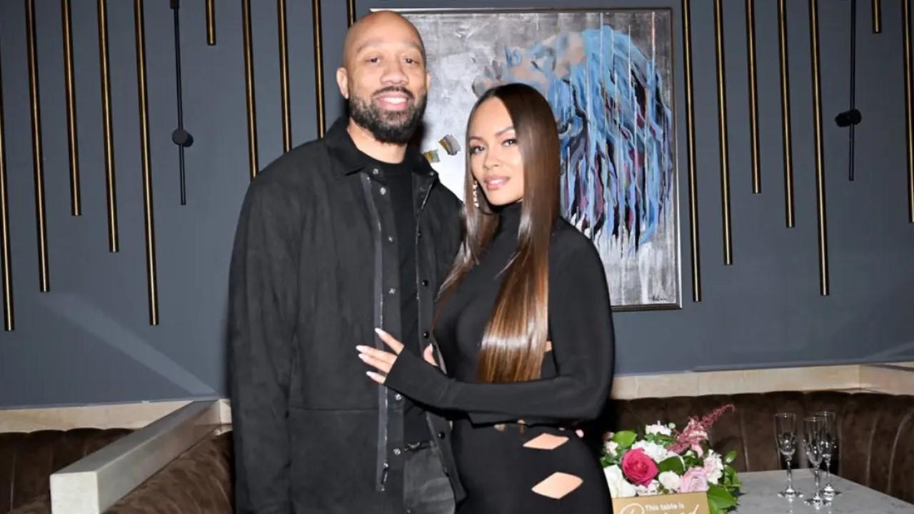 Evelyn Lozada and her fiancé Lavon Lewis wearing all black outfits.