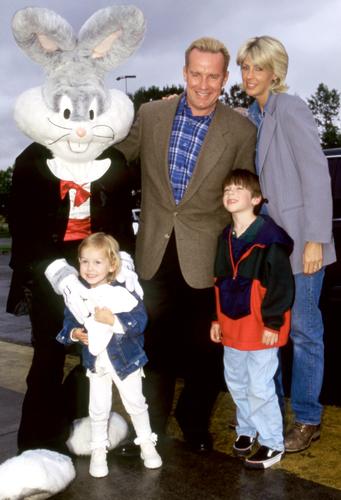 Phil Hartman, wife Brynn, daughter Birgen and son Sean pose for a portrait with Bugs Bunny during an event at Six Flags Magic Mountain, Valencia, California, June 1995