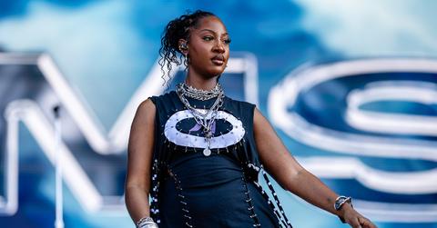 Tems performing on stage in August.