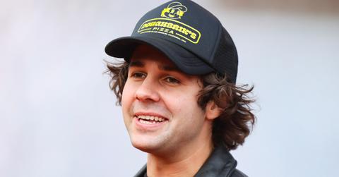 David Dobrik wearing a Doughbrik's pizza hat.